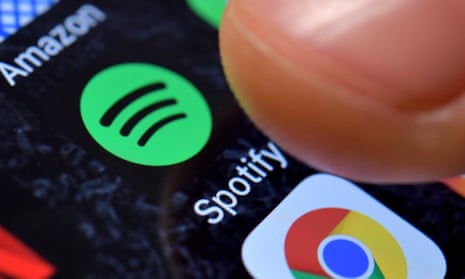 A close-up image showing the Spotify Music app on an iPhone