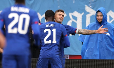 Christian Pulisic #10 of the United States celebrates with Timothy Weah #21 after scoring the opener.