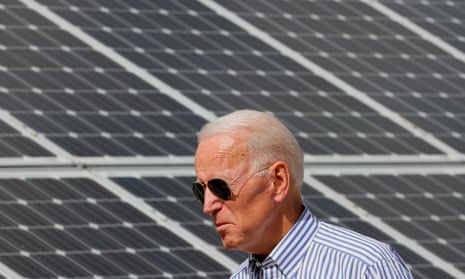 President Joe Biden passes solar panels