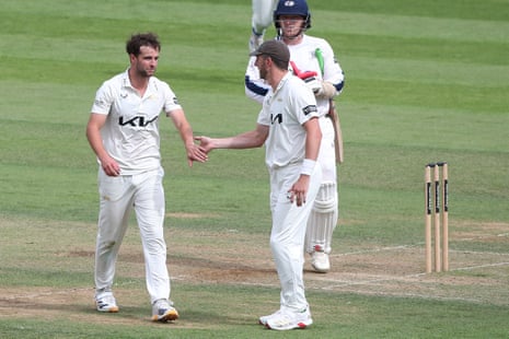 Tom Lawes of Surrey celebrates taking the wicket of Yorkshire's Jack White.