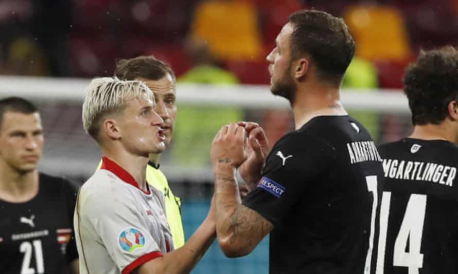 Marko Arnautovic and Ezgjan Alioski talk after the final whistle in Bucharest.