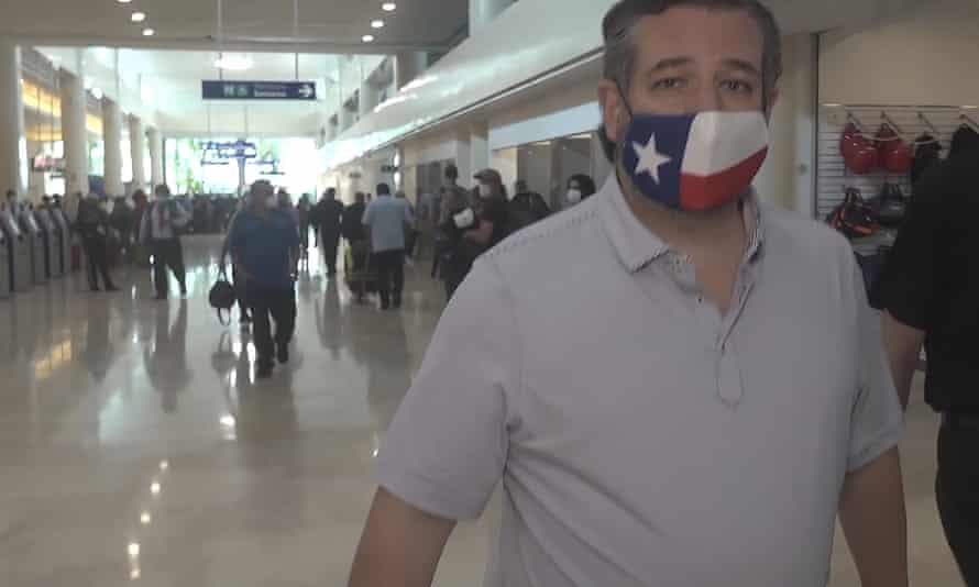 Ted Cruz sports a Texas flag face mask – at Cancun airport in Mexico.
