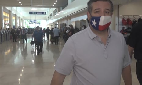 Ted Cruz sports a Texas flag face mask – at Cancun airport in Mexico. 