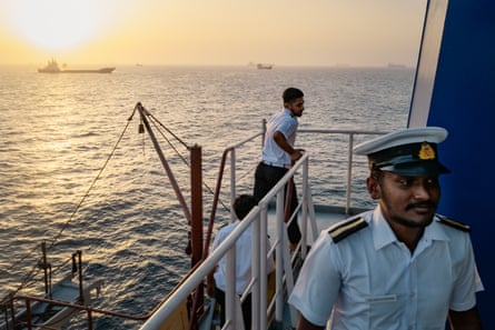 Sailors in uniform on their ship