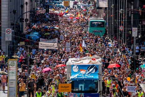 Thousands of people march down Friedrichstrasse in Berlin during a demonstration against coronavirus restrictions