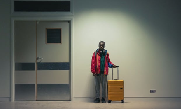 Still from Jungle – a small boy in a corridor.