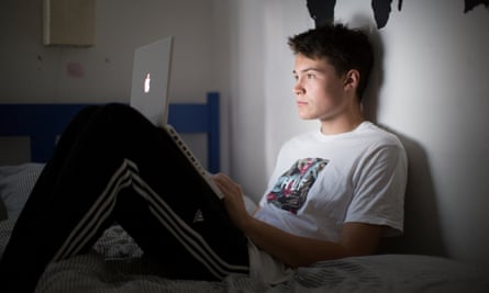 Teenager using a Macbook laptop
