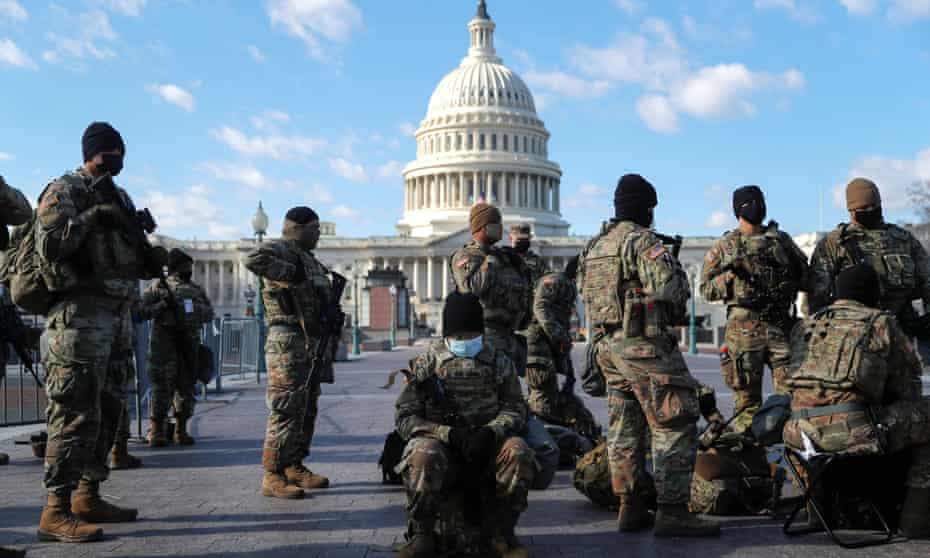 National guard troops gather in front of the US Capitol one day ahead of Joe Biden’s inauguration in Washington, 19 January 2021. 