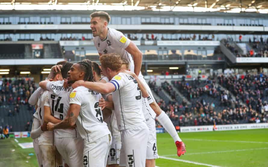 MK Dons’ Liam Manning: ‘I remember having a kickabout on the M25 once’ | MK Dons 2 MK Dons celebrate the Scott Twine goal that sealed last month’s 2-0 victory over Bolton.