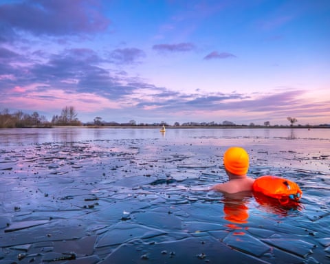 Nottinghamshire, UK ‘A hardy swimmer at Notts County Sailing Club in Hoveringham goes in without a wetsuit. It was -5C on this January day.’