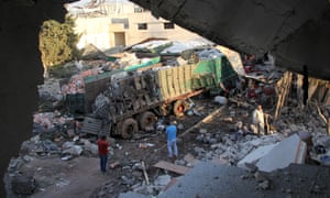 Aid is seen strewn across the floor in the town of Orem al-Kubra on the western outskirts of the northern Syrian city of Aleppo on September 20, 2016, the morning after a convoy delivering aid was hit by a deadly air strike.