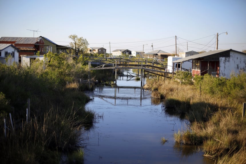 Scenes from the disappearing bayou in Isle de Jean Charles, where the tribe has been awarded $52 million to resettle on higher ground.