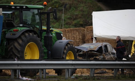 A view of the destroyed vehicle that killed a woman and seriously injured her husband and teenage daughter when they were run over at dawn at a farmers’ roadblock in Pamiers, in the Ariege region of France