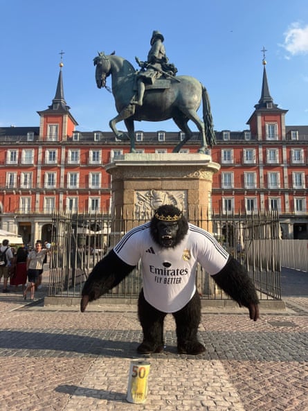 David, 40, working as a street performer in a gorilla suit in Madrid, Spain.