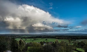 A rainbow falls out of a storm cloud onto Gloucester cathedral. Taken from Nottswood Hill, Longhope.