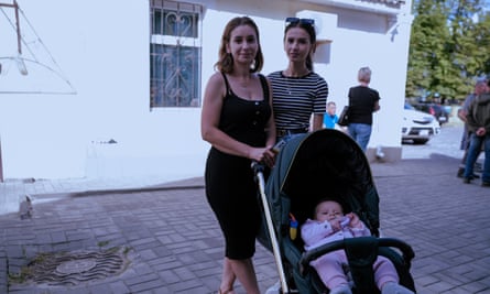Oksana and her daughters, one a teenager, the other a baby