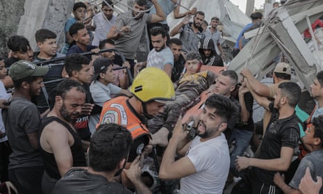 Israel-Hamas war live: White House promises ‘continued flow’ of Gaza aid as Israel steps up airstrikes in north of strip | Israel-Hamas war 14 A boy is pulled from the rubble of a residential building levelled in an airstrike on the Khan Younis refugee camp in southern Gaza on Saturday.