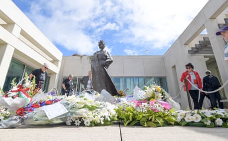 Wreaths are placed around the statue of Queen Elizabeth II at Parliament House in Canberra