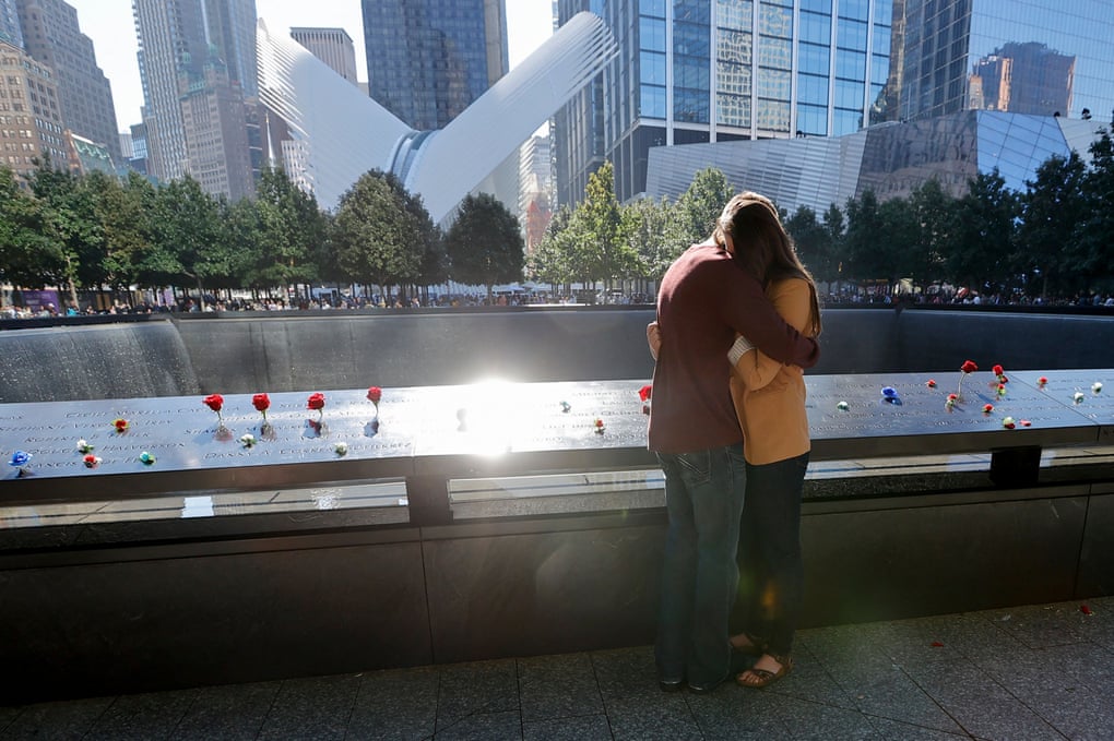 People mourn at the 9/11 Memorial on the 20th anniversary of the September 11 attacks, in Manhattan.