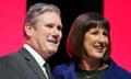 Keir Starmer and Rachel Reeves on stage against a red and black background
