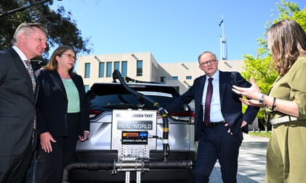 Anthony Albanese and other ministers with a car undergoing efficiency testing in Canberra.