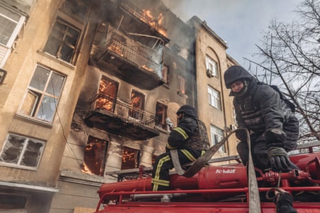 Ukrainian firefighters extinguish a fire after Russian army shelling of Bakhmut, Ukraine on 7 December.