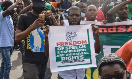 A protester holds a banner during a protest in Lagos last month.