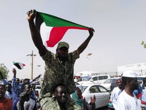Jubilant Sudanese people march towards military headquarters