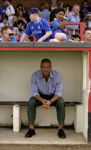 Gianluca Vialli watches from the dugout during a pre-season friendly match against Kingstonian in 1999
