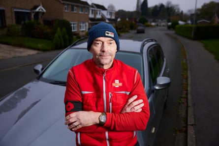 He stands by his car looking fed-up