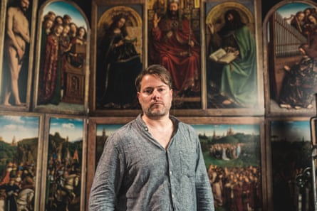 ‘You have to be international and local at the same time’ … theatre director Milo Rau before a reproduction of the Ghent Altarpiece.
