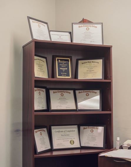 Roy Harness’s certificates and degrees highlighting his accomplishments on display in his office.