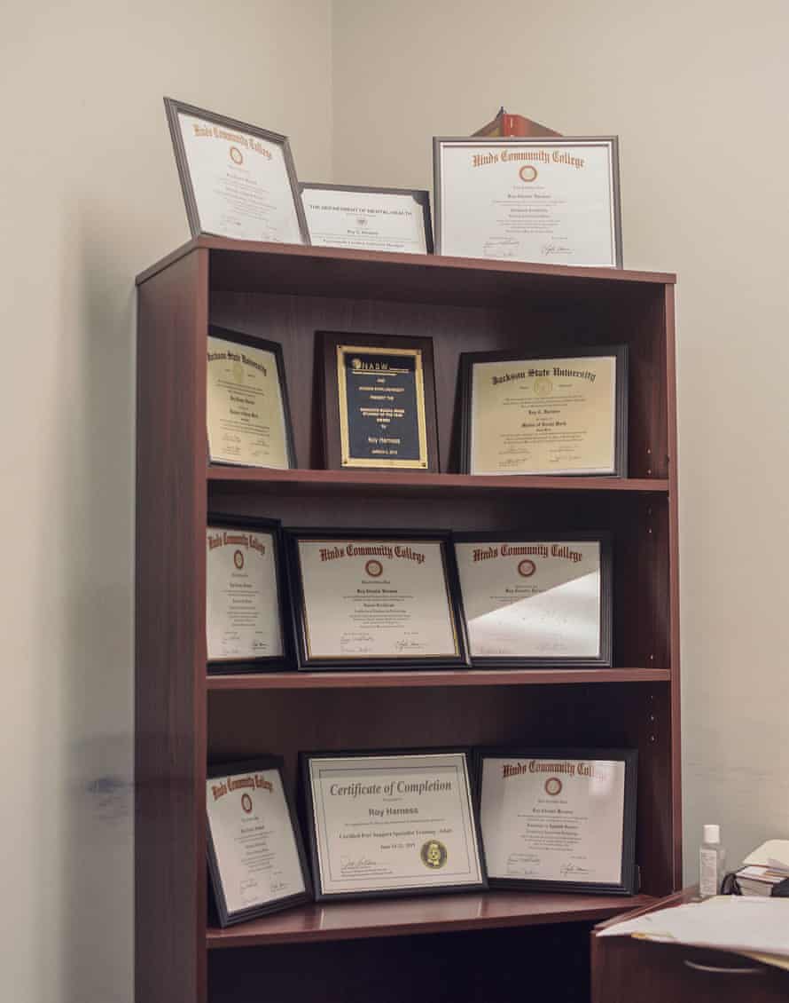 Roy Harness’s certificates and degrees highlighting his accomplishments on display in his office.