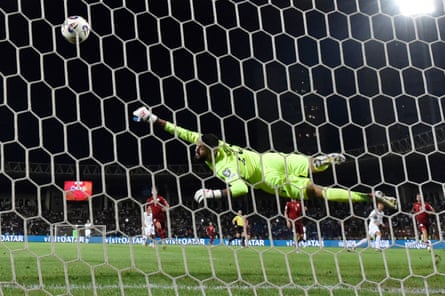 Armenia’s goalkeeper, Henri Avagyan, dives for the ball