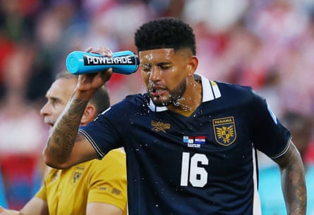 Panama’s Andres Andrade squirts water from a blue bottle onto his forehead
