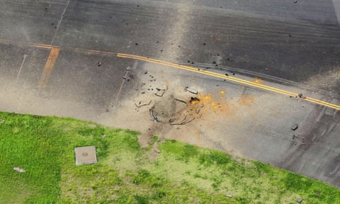Part of a damaged taxiway at Miyazaki airport. qhiukiuiqkdinv