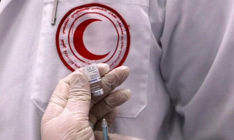 A Palestinian Red Crescent health worker prepares a dose of Russia’s Sputnik V Covid-19 vaccine in the West Bank city of Hebron.