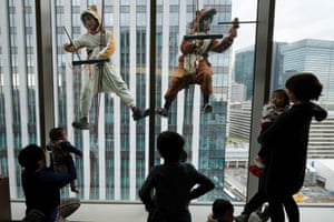 Tokyo, Japan: Workers dressed in dog and wild boar costumes