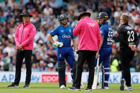 Jos Buttler of England (second left) with Ben Stokes of England whilst they wait for the outcome of a review before Buttler was given out during the 3rd Metro Bank ODI between England and New Zealand at The Kia Oval.