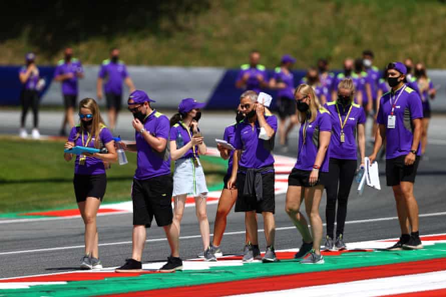 The teams and drivers walk the track in Austria before the race on Saturday.