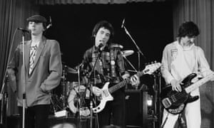 Pete Shelley, centre, with Howard Devoto, left, and Steve Diggle performing with Buzzcocks at the Lesser Free Trade Hall, Manchester, in the late 70s.