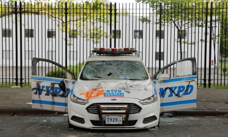 A vandalized New York police vehicle is seen the morning after a protest in Brooklyn on Saturday.