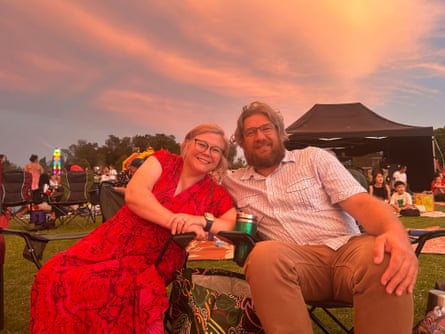 Karen Bleakley and Matt sitting side-by-side as the sun sets