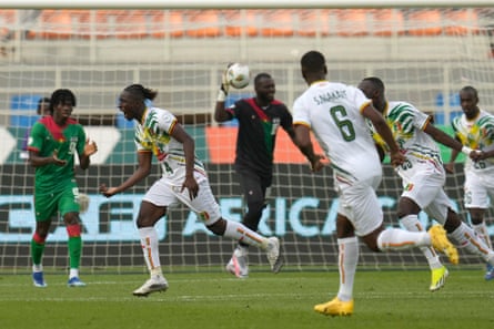 Mali players celebrate after Burkina Faso's Edmond Tapsoba scored an own goal in the opening minutes.