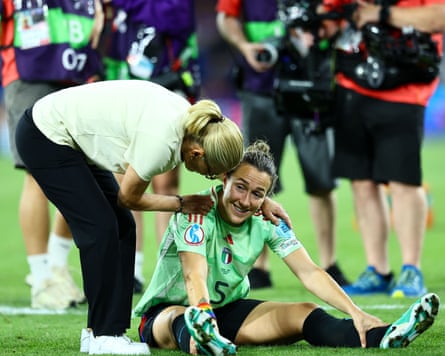 Sarina Wiegman embraces Lucy Bronze after England’s extra-time win over Italy.
