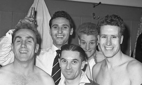 Roy Swinbourne, right, celebrates with Billy Wright. left, and their Wolves team-mates after their glorious victory over Honved in 1954.