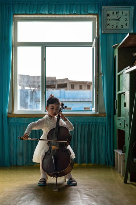 A girl plays a cello at Chongam kindergarten in Chongjin