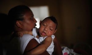 Nadja Cristina Gomes Bezerra hold her three-month-old daughter, Alice Vitoria, who has microcephaly.