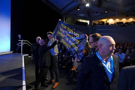 Protesters interruptinf Environment Secretary Steve Reed as he delivers his speech during the National Farmers’ Union annual conference at the QEII Centre in London today.