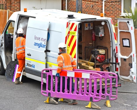 An Anglian Water crew attend a street sewer connection to residential property in the east of England.